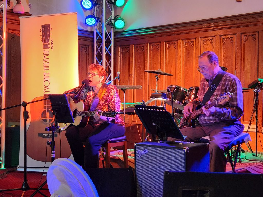 Yvonne performing at a coffee house